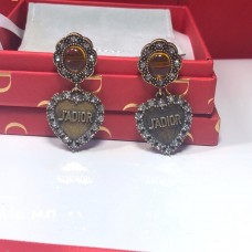 Cercei Dior L'Amour Avenir cu pandantiv inimă și cristale galbene, cu diamante în nuanțe de auriu învechit