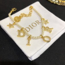 Brățară Dior Dioevolution din aur galben, pavată cu diamante, cu logo DIOR, pentru femei, cu perle albe